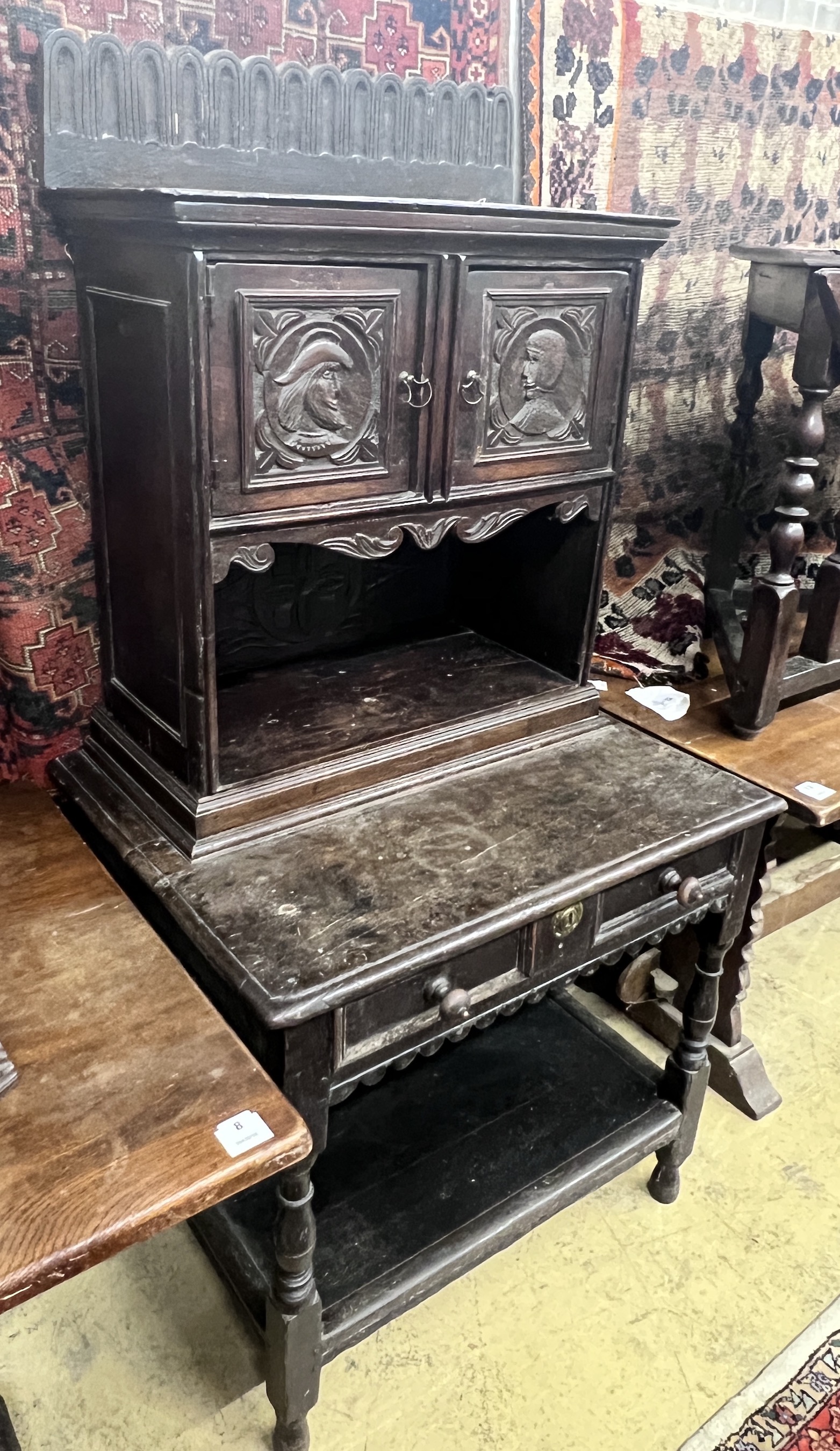 An 18th century style Flemish carved oak side cabinet, width 80cm, depth 62cm, height 165cm